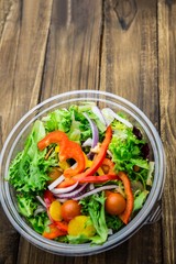 Healthy bowl of salad on table