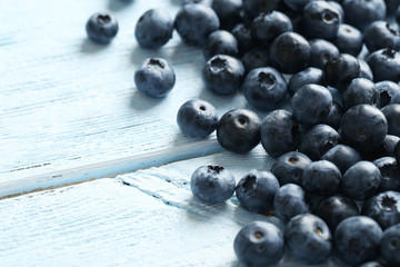 Blueberries on a blue wooden background