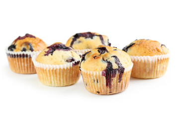 Tasty blueberry muffins isolated on a white