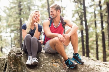 Young happy hiker couple looking at each other