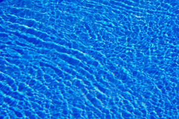 Blue water background in the swimming pool