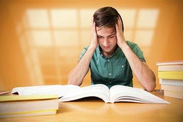 Composite image of student sitting in library reading 