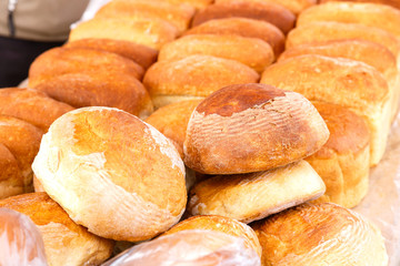 A lot of loaves of fresh rice bread on the market