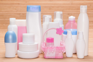 Different cosmetic products for skincare on wooden surface