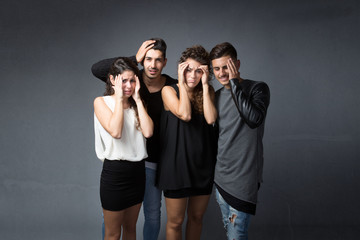 group of friends with headache