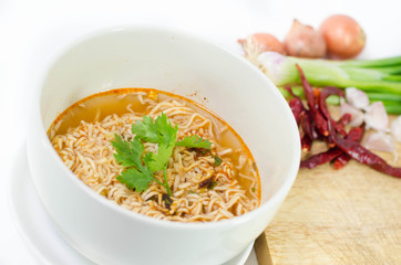 Tasty instant noodles in bowl isolated on white
