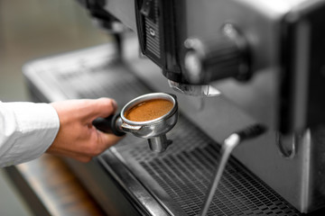 Putting holder to the coffee machine