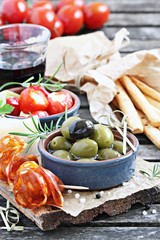 Antipasto appetizer on a wooden table.Selective focus