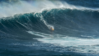 MAUI, HAWAII, USA - DECEMBER 15, 2013: Unknown surfer is riding