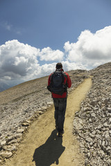 Man hiking in Dolomite Mountains