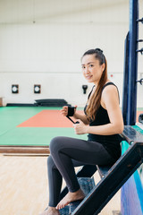 Fototapeta na wymiar Asian woman hand wrapping in the gym