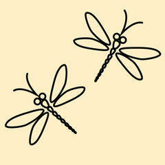 Two vector dragonflies silhouettes on the creamy background
