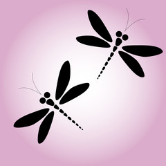 Two vector black dragonflies on the pink background
