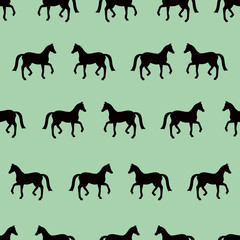 Green vector seamless pattern with black horses silhouettes