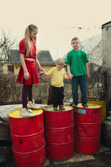 children play at dump drums