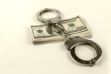  steel handcuffs and dollars