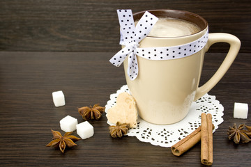 a hot Cup of coffee on wooden table