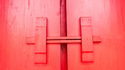 Red color door old Thai wood door