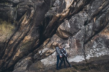 Fototapeta premium couple in love, walk on the rocks Dovbush Carpathian Mountains