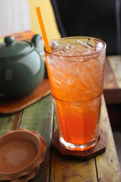 plum soda cocktail on wood table
