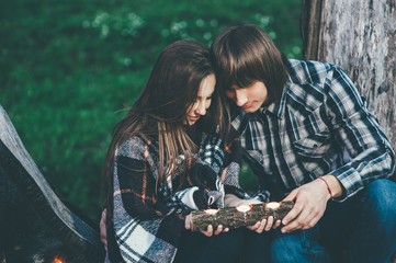 couple in love, outdoors near old tree