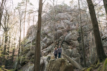 couple in love, walk on the rocks Dovbush Carpathian Mountains