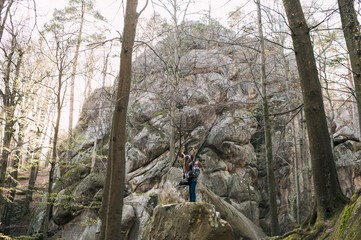 Fototapeta premium couple in love, walk on the rocks Dovbush Carpathian Mountains