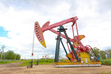 Fototapeta na wymiar Pink Oil pump of crude oilwell rig