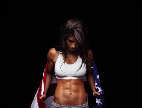 Muscular woman with American flag