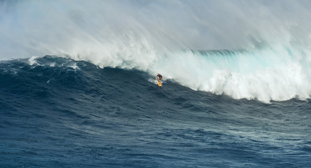 MAUI, HAWAII, USA - DECEMBER 15, 2013: Unknown surfer is riding