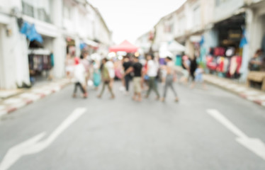 Blurred people walking on the street
