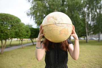 girl with the globe in park