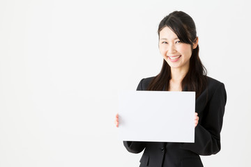 Naklejka premium asian businesswoman holding blank whiteboared on white background