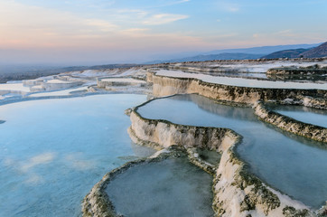 Carbonate travertines the natural pools during sunset, Pamukkale