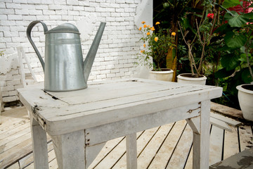 watering can on table