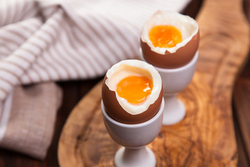 Boiled eggs on a wooden background