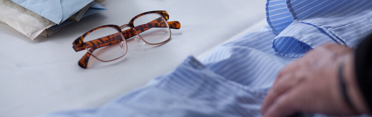 Glasses and male blue shirt