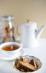 Italian cookies cantuccini biscotti with teapot and tea