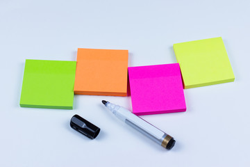 Arrangement of colored sticky notes with marker pen