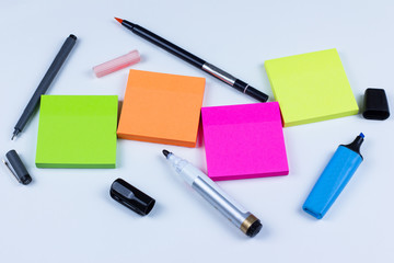 Colored sticky notes with pens and markers