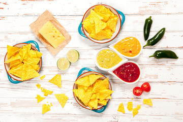 Plate of nachos with different dips