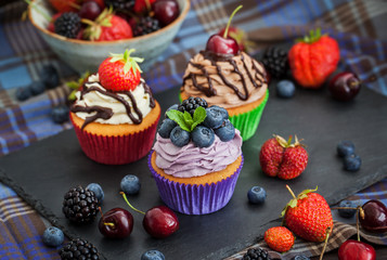 Set of different delicious cupcakes