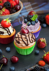 Set of different delicious cupcakes