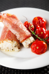 White fish wrapped in bakon