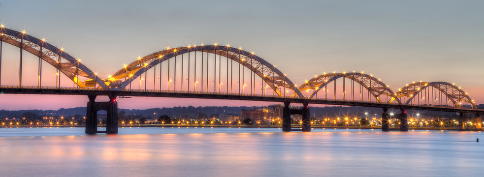 Centennial Bridge across the Mississippi River at dusk between Rock Island, Illinois and Davenport, Iowa