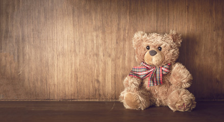 Teddy bear on a wooden shelf