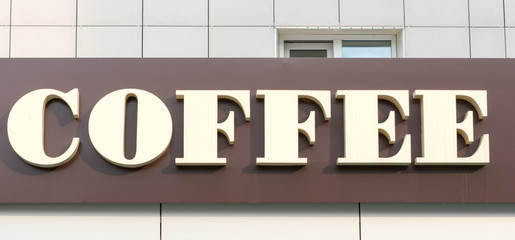 Obraz premium coffee signboard with brown background 1