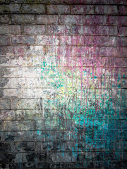 Dirty brick wall painted with spots of paint colors - 89299956