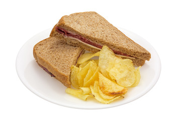 Roast beef sandwich with cheese on wheat with chips