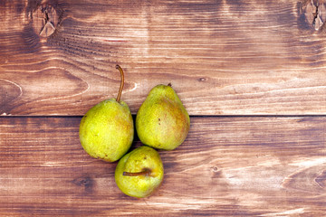 Pears on a wooden background